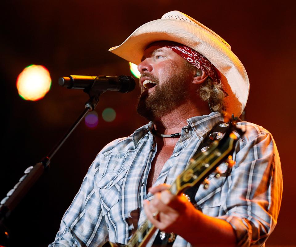 Toby Keith performs during the Oklahoma Twister Relief Concert, benefiting victims of the May tornadoes, at Gaylord Family - Oklahoma Memorial Stadium on the campus of the University of Oklahoma in Norman, Okla., Saturday, July 6, 2013. Photo by Nate Billings, The Oklahoman