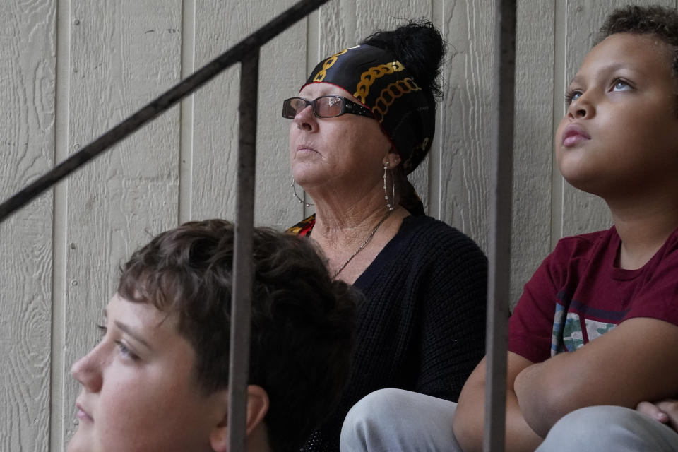 Kim Carlson, from left, and her two grandsons Thomas Heidt, 12, and Treveyon Carlson, 9, pose for a photograph outside her apartment at the Delta Pines complex, Friday, Nov. 4, 2022, in Antioch, Calif. Despite a landmark renter protection law approved by California legislators in 2019, tenants across the country’s most populous state are taking to ballot boxes and city councils to demand even more safeguards. They want to crack down on tenant harassment, shoddy living conditions and unresponsive landlords that are usually faceless corporations. (AP Photo/Godofredo A. Vásquez)