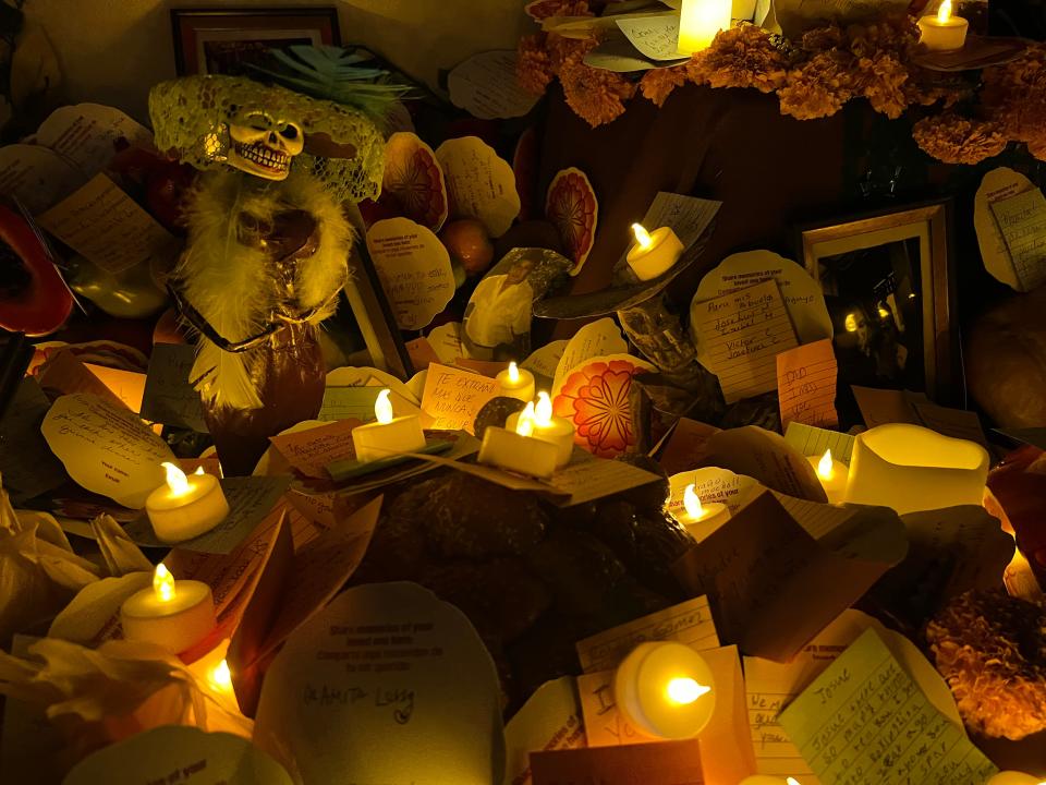 Candles, messages and "ofrendas," or offers, for loved ones are displayed at an altar at the Día de Los Muertos celebration at the Hollywood Forever Cemetery in Los Angeles on Saturday, Oct. 28, 2023.