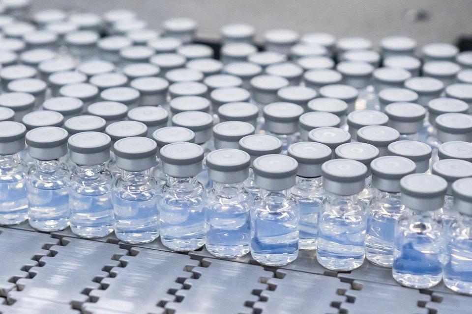 This August 2022 photo provided by Pfizer shows vials of the company's updated COVID-19 vaccine during production in Kalamazoo, Michigan. U.S. regulators have authorized updated COVID-19 boosters, the first to directly target today's most common omicron strain.