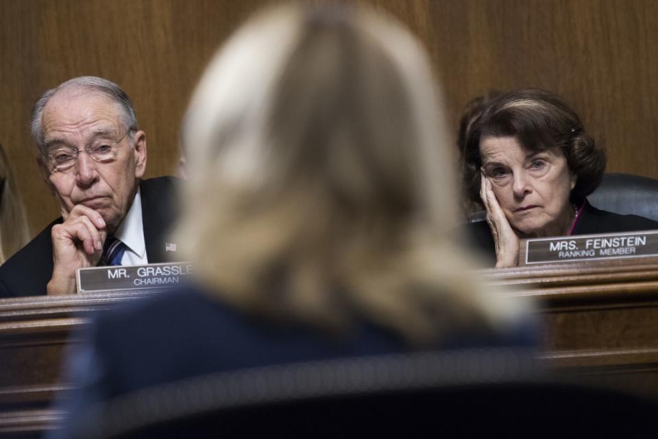 Judiciary Committee Chair Charles Grassley and ranking Democrat Dianne Feinstein listen to Christine Blasey Ford testify