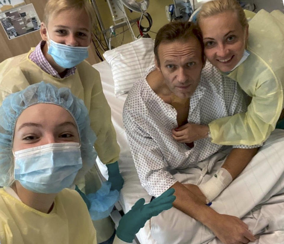 This handout photo published by Russian opposition leader Alexei Navalny on his instagram account, shows himself, centre, and his wife Yulia, right, daughter Daria, and son Zakhar, top left, posing for a photo in a hospital in Berlin, Germany. Russian opposition leader Alexei Navalny has posted the picture of himself in a hospital in Germany and says he's breathing on his own. He posted on Instagram Tuesday Sept. 15, 2020: "Hi, this is Navalny. I have been missing you. I still can't do much, but yesterday I managed to breathe on my own for the entire day." (Navalny instagram via AP)