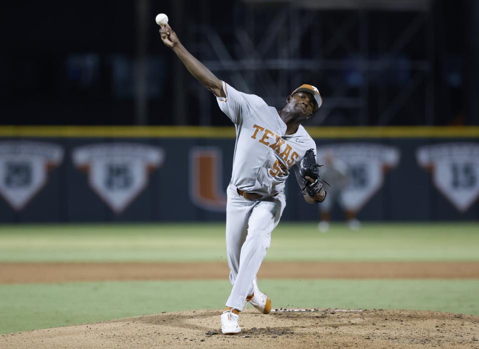 Texas pitcher Lebarron Johnson Jr. throws in the first inning against Miami during an NCAA college baseball tournament regional game in Coral Gables, Fla., Saturday, June 3, 2023. (Al Diaz/Miami Herald via AP)