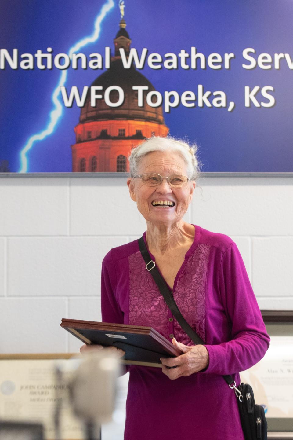 Melba Bruce smiles after being recognized for her service as a volunteer weather observer for the National Weather Service Topeka location during a picnic this past last week.