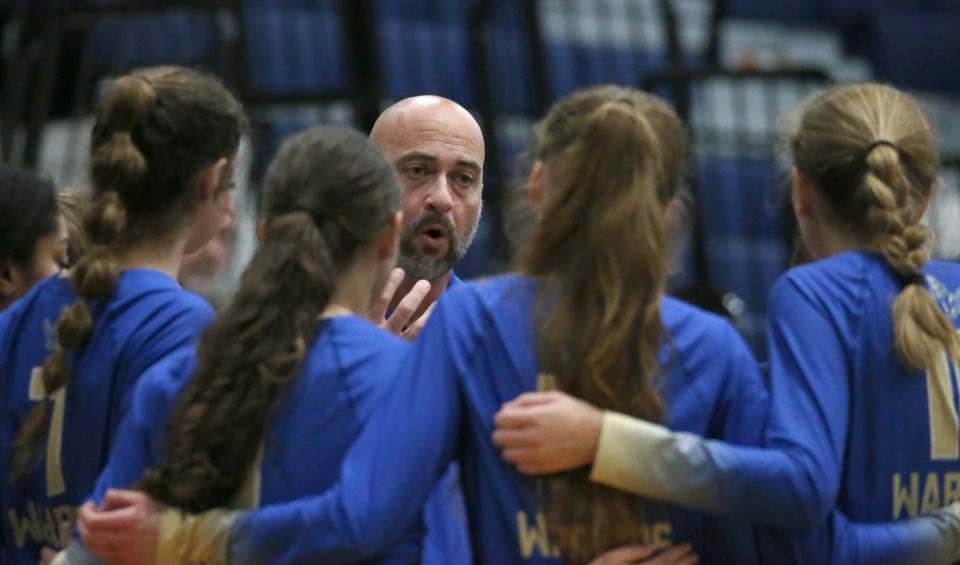 Schroeder head coach Pete DeWitte talks to his squad during a time out.