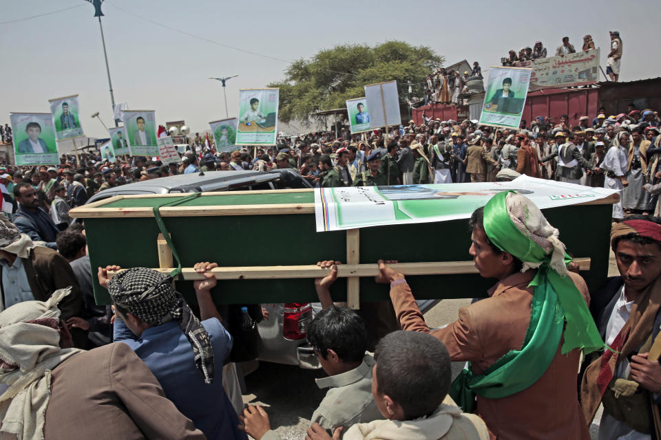 Yemeni people carry the coffin of a victim of a Saudi-led airstrike, during a funeral in Saada, Yemen, Monday, Aug. 13, 2018. Yemen's shiite rebels are backing a United Nations' call for an investigation into the airstrike in the country's north that killed dozens of people including many children. (AP Photo/Hani Mohammed)