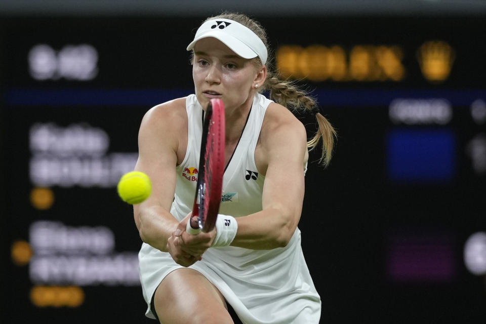 FILE - Kazakhstan's Elena Rybakina returns to Britain's Katie Boulter in a women's singles match on day six of the Wimbledon tennis championships in London, Saturday, July 8, 2023. Rybakina is one of the women to watch at the U.S. Open, which begins at Flushing Meadows on Aug. 28.(AP Photo/Alastair Grant, File)