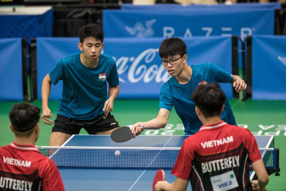 Singapore table tennis players Koen Pang (left) and Josh Chua clinched a silver in the men's doubles at the SEA Games. (PHOTO: Sport Singapore / Dyan Tjhia)