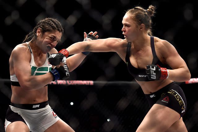 <p>Buda Mendes/Zuffa LLC via Getty</p> Ronda Rousey of the United States punches Bethe Correia of Brazil in their bantamweight title fight during the UFC 190 Rousey v Correia at HSBC Arena on August 1, 2015 in Rio de Janeiro, Brazil.