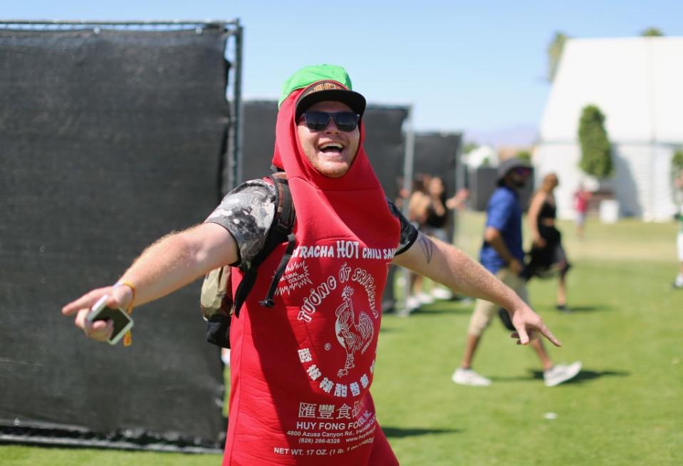 INDIO, CA - APRIL 14: Festivalgoer dressed as a Sriracha bottle during day 1 of the Coachella Valley Music And Arts Festival (Weekend 1) at the Empire Polo Club on April 14, 2017 in Indio, California. (Photo by David McNew/Getty Images for Coachella)