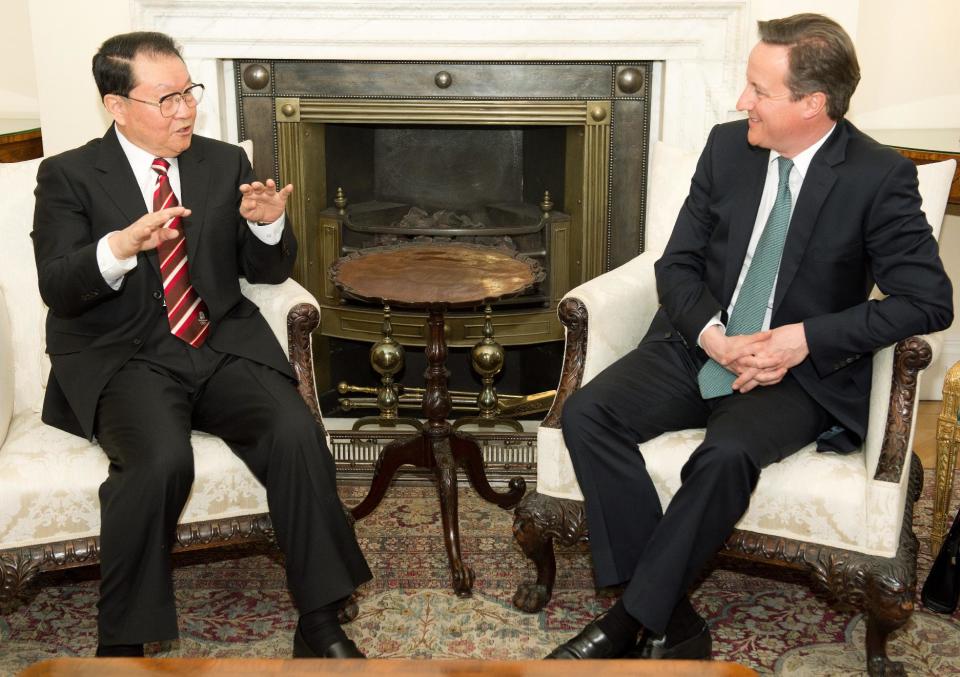 Chinese Communist Party official Li Changchun, left, speaks with British Prime Minister David Cameron, during their meeting at Downing Street in central London on Tuesday April 17, 2012. (AP Photo/Leon Neal. Pool)