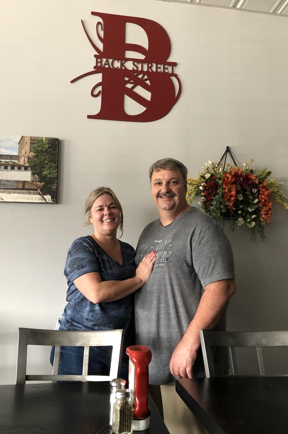 Paul Pelletier and his fiancee, Jill Brown, seen here on July 11, 2023, in the dining room of Back Street Sanford, the restaurant Pelletier owned and operated for five years. Pelletier is retiring and selling the popular spot on School Street in Sanford, Maine.