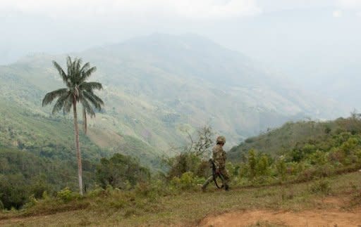 A Colombian soldier patrols in the department of Cauca, a known stronghold of the FARC rebels, in July 2012. Colombian President Juan Manuel Santos confirmed that his government had begun "exploratory discussions" with leftist FARC rebels to lay the groundwork for a full-fledged peace process