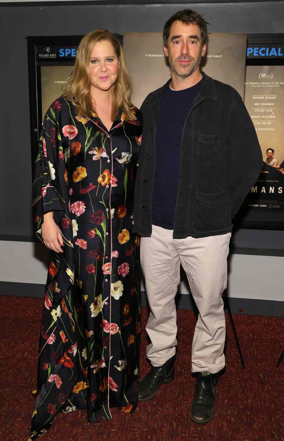 Amy Schumer and Chris Fischer attend as A24 and the Cinema Society host a screening of "The Humans" at Village East Cinema on November 18, 2021 in New York City