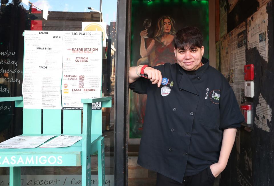 Bonnie Saran standing in the doorway of her White Plains restaurant Little Drunken Chef Nov. 12, 2021. Saran will again be serving free Thanksgiving dinner for anyone in need.