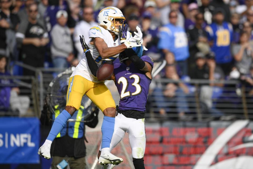 Ravens cornerback Anthony Averett breaks up a pass intended for Chargers wide receiver Jalen Guyton.