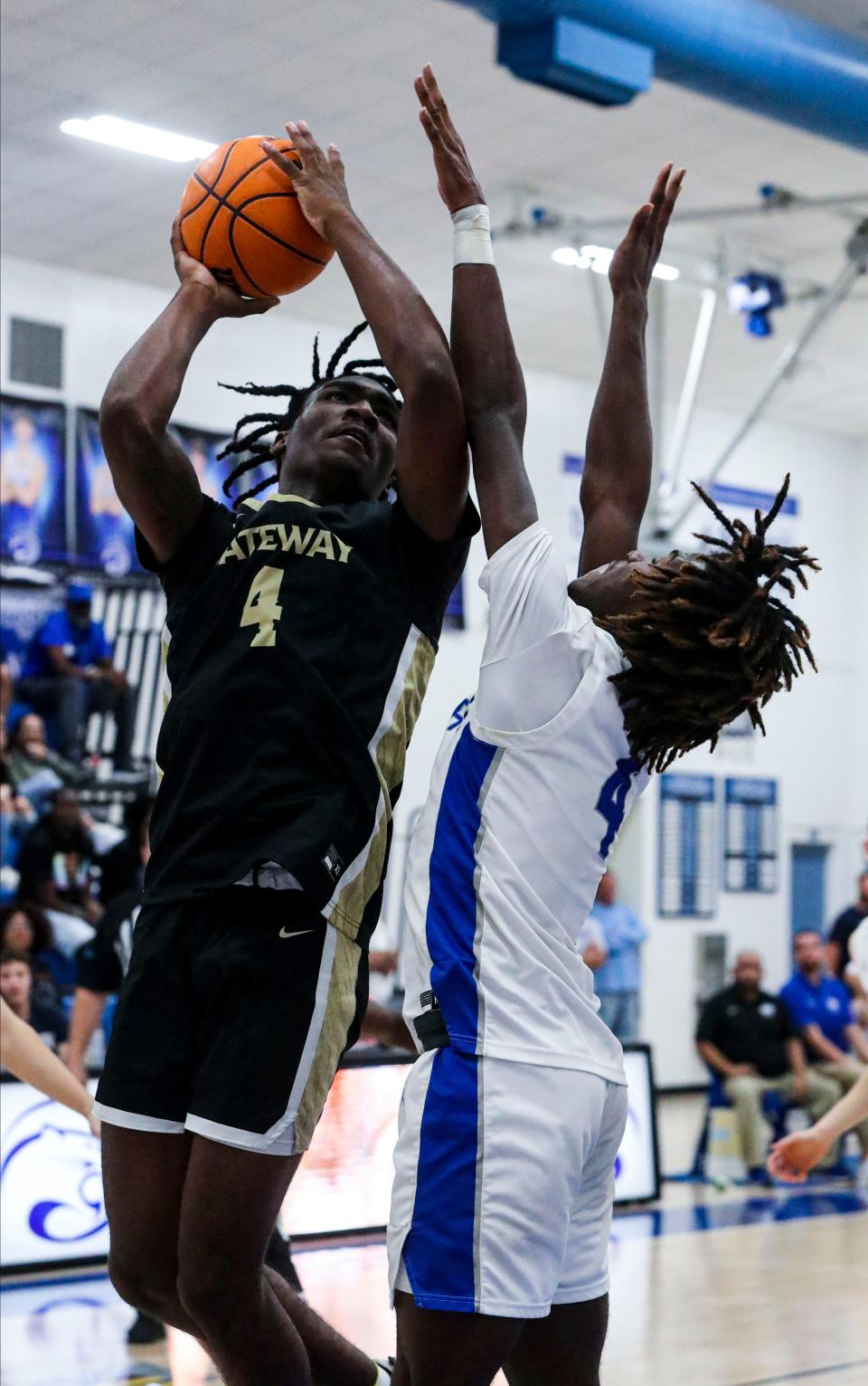 Gateway High's Eugene Alvin looks to score on Canterbury's James Bryant for the rebound. Gateway High pulled out the win in overtime over Canterbury in their Class 3A-District 8 final boys basketball game, February 11, 2022.