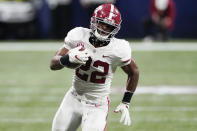 Alabama running back Najee Harris (22) runs against Florida during the second half of the Southeastern Conference championship NCAA college football game, Saturday, Dec. 19, 2020, in Atlanta. Harris has been selected to The Associated Press All-America first-team offense, Monday, Dec. 28, 2020. (AP Photo/John Bazemore)