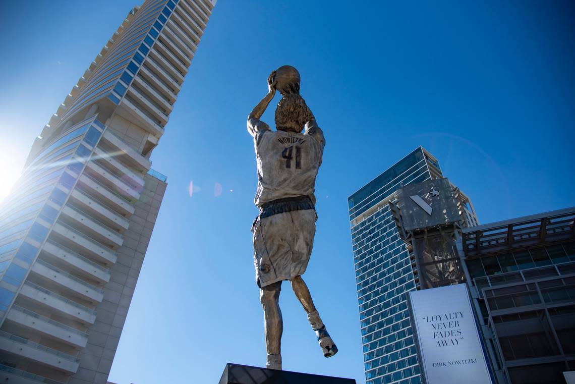 Dirk Nowitzki’s statue is unveiled during the “All Four One” statue ceremony in front of the American Airlines Center in Dallas, Sunday, Dec. 25, 2022. (AP Photo/Emil T. Lippe)