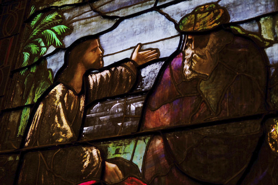 A stained-glass window depicts Jesus at Turning Point United Methodist Church in Trenton, N.J. on Monday, May 13, 2024. Earlier this month, delegates at a United Methodist conference struck down longstanding anti-LGBTQ bans and created a path for clergy ousted because of them to seek reinstatement. (AP Photo/Luis Andres Henao)