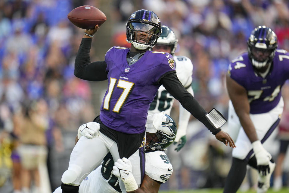 Baltimore Ravens quarterback Josh Johnson (17) passes as Philadelphia Eagles defensive tackle Jalen Carter applies pressure during the first half of an NFL preseason football game in Baltimore, Saturday, Aug. 12, 2023. (AP Photo/Julio Cortez)