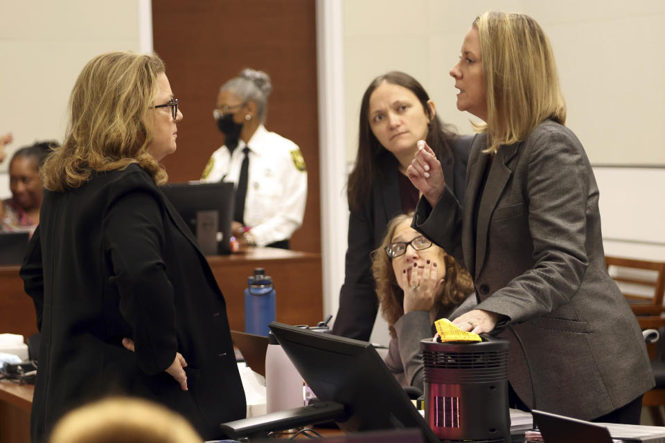 Assistant State Attorney Carolyn McCann, left, and Assistant Public Defender Melisa McNeill speak before the start of jury pre-selection in the penalty phase of the trial of Marjory Stoneman Douglas High School shooter Nikolas Cruz at the Broward County Courthouse in Fort Lauderdale on Wednesday, April 13, 2022. McCann, on behalf of the prosecution, proposed excusing all of the jury panels screened to date and starting over due to an issue with 11 jurors who were prematurely released from service. Cruz previously plead guilty to all 17 counts of premeditated murder and 17 counts of attempted murder in the 2018 shootings. (Amy Beth Bennett/South Florida Sun Sentinel via AP, Pool)