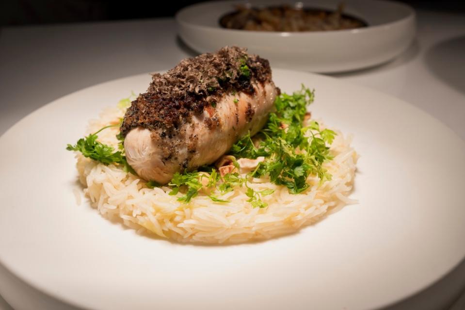 A juicy chicken breast is coated in crumbs of black truffles. Stefano Giovannini