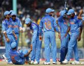 India's fielders celebrate the dismissal of Bangladesh's Shamsur Rahman (unseen) during their Asia Cup 2014 one-day international (ODI) cricket match in Fatullah February 26, 2014.