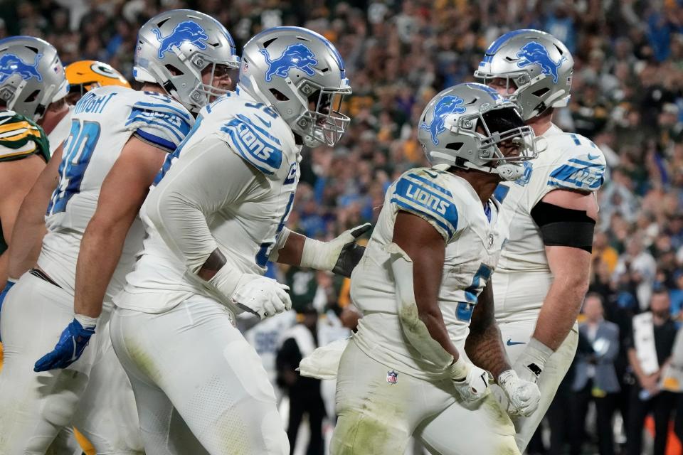 Detroit Lions running back David Montgomery (5) celebrates after a 1-yard touchdown run during the second half against the Green Bay Packers at Lambeau Field in Green Bay, Wisconsin, on Thursday, Sept. 28, 2023.