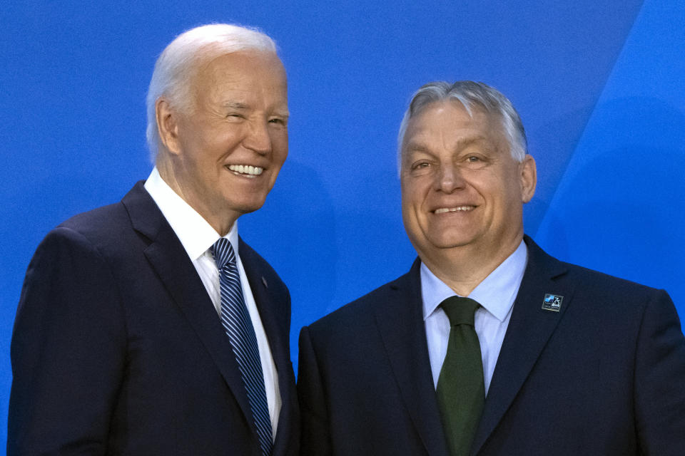 President Joe Biden, left, greets Viktor Orban, Prime Minister of Hungary, as he arrives for a welcome ceremony at the NATO summit in Washington, Wednesday, July 10, 2024. (AP Photo/Mark Schiefelbein)