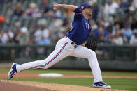 Texas Rangers starting pitcher Jacob deGrom delivers during the first inning of a spring training baseball game against the Seattle Mariners, Sunday, March 19, 2023, in Surprise, Ariz. The ace-righthander, who signed a five-year, $185 million contract with the Rangers in the offseason, will face Philadelphia's Aaron Nola when the 2023 Major League Baseball season opens next Thursday. (AP Photo/Abbie Parr)