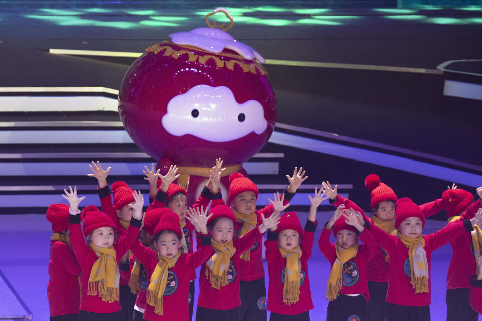 Children perform near the 2022 Winter Paralympic Games mascot Shuey Rong Rong during a ceremony held at the Shougang Ice Hockey Arena in Beijing on Tuesday, Sept. 17, 2019. (AP Photo/Ng Han Guan)