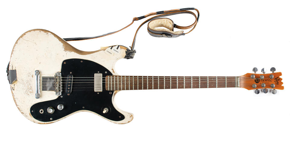 This Aug. 2021 photo provided by Boston-based RR Auction shows a 1965 Mosrite Ventures II electric guitar played by Johnny Ramone. The guitar sold at auction over the weekend for more than $900,000, the auctioneer said Monday, Sept. 27, 2021. Ramone, whose real name was John Cummings, bought the guitar to replace his original blue Ventures II, which was stolen, according to RR Auction. (Photo Nikki Brickett/RR Auction via AP)