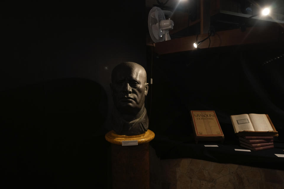 A bust of Benito Mussolini is displayed during an exhibit titled "100 years of history between revolutions and counter revolutions" inaugurated on the occasion of the 100th anniversary of the march on Rome by the Fascist, in Predappio, Friday, Oct. 28, 2022. (AP Photo/Luca Bruno)