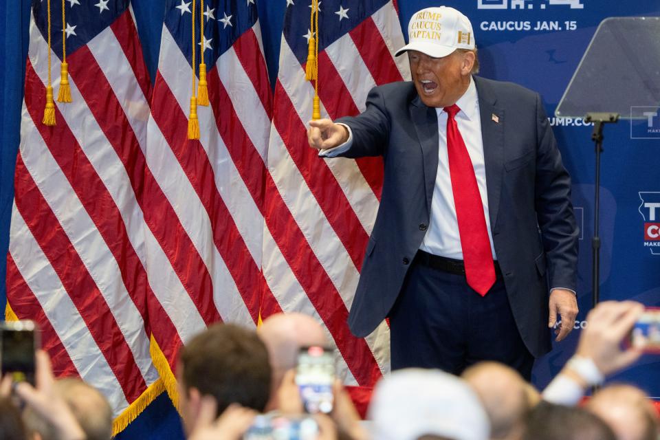 Former President Donald Trump points to the crowd during a campaign event ahead of the Iowa Caucus on Sunday, Jan. 14, 2024, at Simpson College in Indianola.