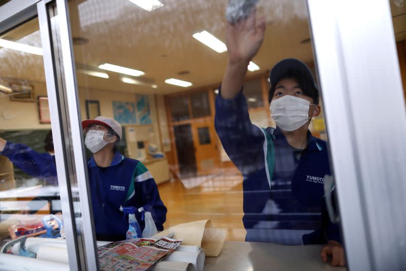 The Wider Image: Last students graduate: School closures spread in ageing Japan