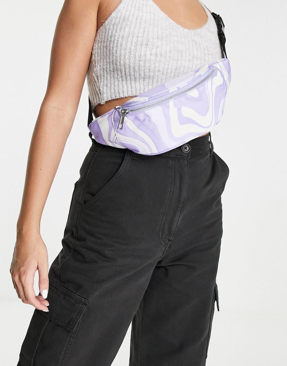 <p><a href="https://go.redirectingat.com?id=74968X1596630&url=https%3A%2F%2Fwww.asos.com%2Fus%2Fasos-design%2Fasos-design-swirl-print-fanny-pack-in-lilac%2Fprd%2F201617936&sref=https%3A%2F%2Fwww.oprahdaily.com%2Fstyle%2Fg25926498%2Fcute-fanny-packs%2F" rel="nofollow noopener" target="_blank" data-ylk="slk:Shop Now;elm:context_link;itc:0;sec:content-canvas" class="link ">Shop Now</a></p><p>Swirl-Print Fanny Pack</p><p>us.asos.com</p><p>$15.00</p>