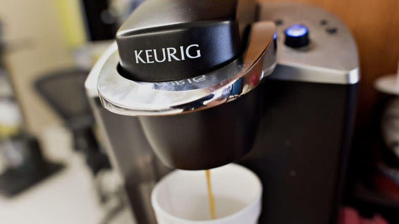 Close-up of Keurig brewing coffee