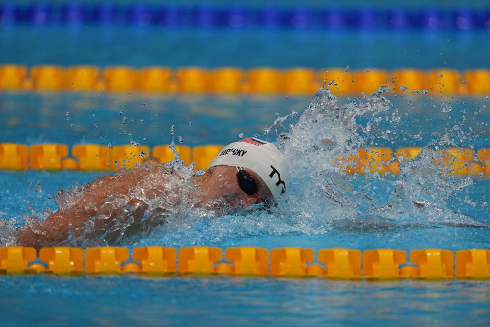 Katie Ledecky, of the United States, swims in a heat during the women's 400-meter freestyle at the 2020 Summer Olympics, Sunday, July 25, 2021, in Tokyo, Japan. (AP Photo/Matthias Schrader)