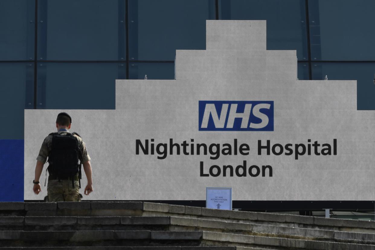 A member of the armed forces walks at the NHS Nightingale Hospital on the site of the ExCeL London exhibition centre in London on April 2, 2020, which is operating as a field hospital to help with the novel coronavirus COVID-19 pandemic. - Prime Minister Boris Johnson said Britain would "massively increase testing" amid a growing wave of criticism on Thursday about his government's failure to provide widespread coronavirus screening. (Photo by DANIEL LEAL-OLIVAS / AFP) (Photo by DANIEL LEAL-OLIVAS/AFP via Getty Images)