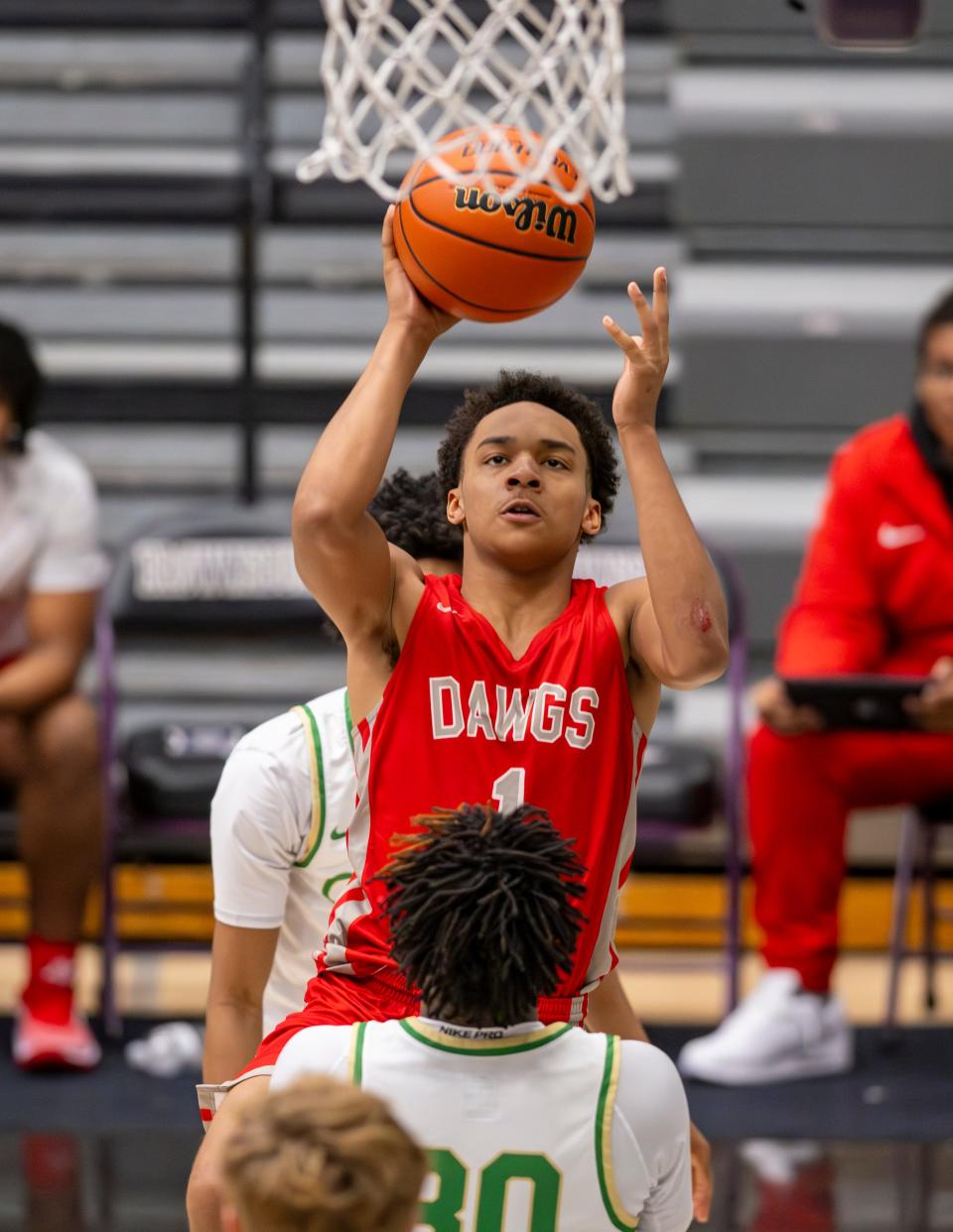 Evansville Bosse High School junior Tizaun Tomlinson (1) shoots during the second half of a varsity game against Indianapolis Cathedral High School in the SNKRS4SANTA Shootout, Saturday, Dec. 2, 2023, at Brownsburg High School. Cathedral won, 80-49.