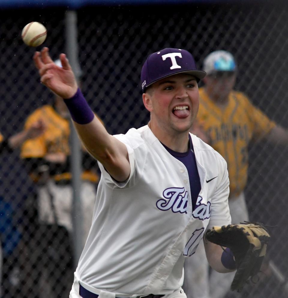 Triway first baseman Griffin Braun attempts to throw out a Beachwood runner.