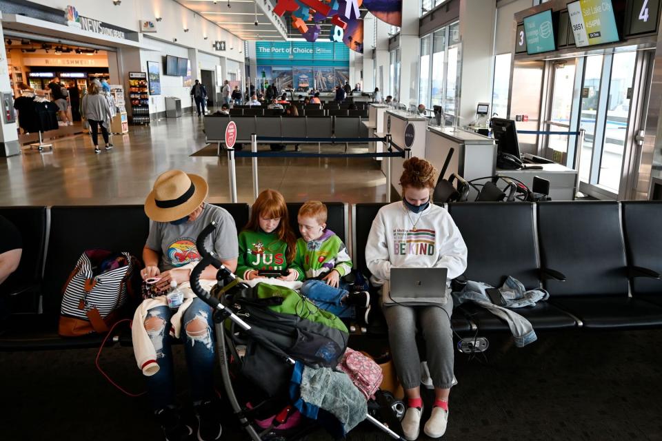 A family waits to depart from Long Beach Airport in Long Beach on Thursday, November 18, 2021.