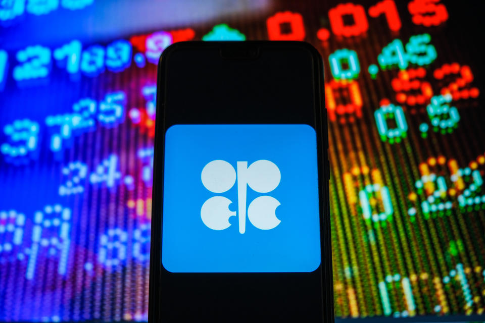 In this photo illustration, an OPEC logo seen displayed on a smartphone with stock market prices in the background. (Photo by Omar Marques / SOPA Images/Sipa USA)