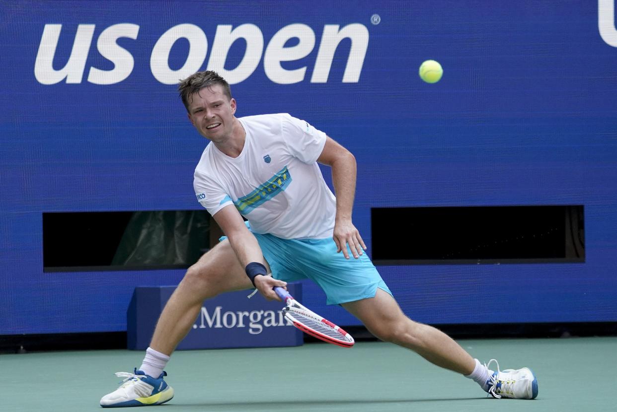 Stefan Kozlov, of the United States, returns a shot to Daniil Medvedev, of Russia, during the first round of the U.S. Open tennis championships, Monday, Aug. 29, 2022, in New York.