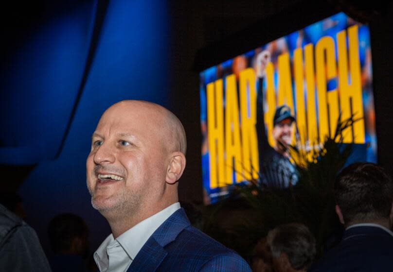 Chargers new general manager Joe Hortiz talks to a person following the introductory press conference of coach Jim Harbaugh.