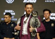 Sep 20, 2018; New York, NY, USA; Conor McGregor with belts during a press conference for UFC 229 at Radio City Music Hall. Mandatory Credit: Noah K. Murray-USA TODAY Sports