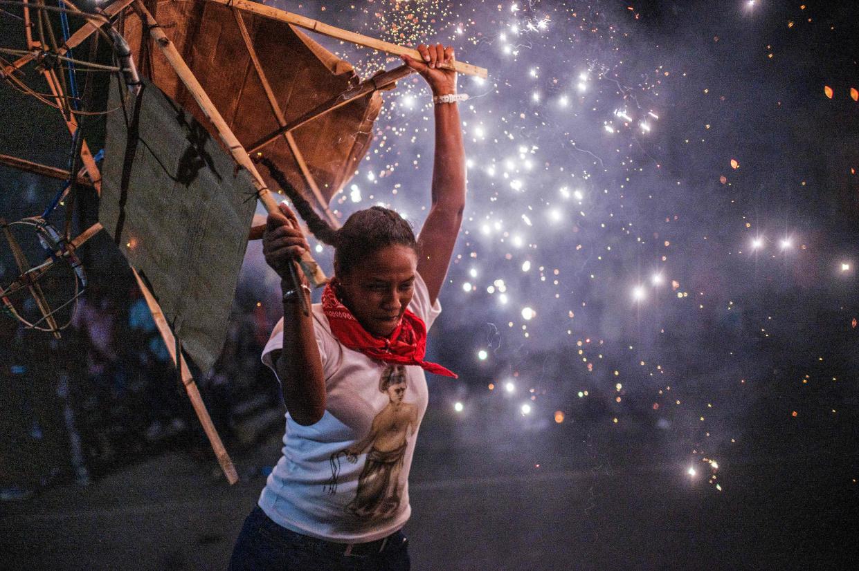 A member of the Afro-Mexican community carries a "toritol" of fire during the annual festival dedicated to San Nicolas Tolentino, in Cuajinicuilapa, Guerrero state, Mexico, on September 9, 2020, amid the COVID-19 coronavirus pandemic. - Although there are 1,5 million African descendants in a country of 128 million inhabitants, it is normal to hear that "in Mexico there are no blacks". (Photo by PEDRO PARDO / AFP) (Photo by PEDRO PARDO/AFP via Getty Images)