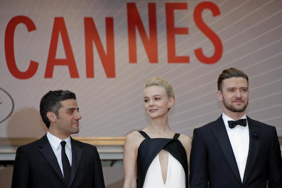 From left, actors Oscar Isaac, Carey Mulligan and Justin Timberlake arrive for the screening of the film Inside Llewyn Davis at the 66th international film festival, in Cannes, southern France, Sunday, May 19, 2013. (AP Photo/Lionel Cironneau)