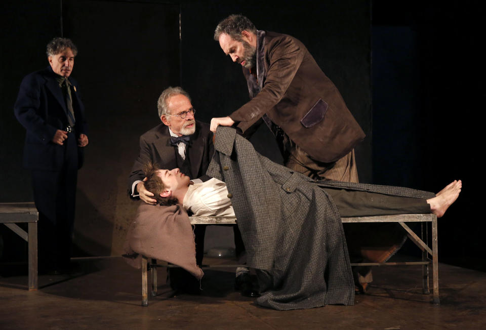 This theater image released by The Public Theater shows, from left, Chip Zien, Ron Rifkin, Noah Robbins, and Daniel Oreskes in "The Twenty-Seventh Man," running at The Public Theater at Astor place through Dec. 9. (AP Photo/The Public Theater, Joan Marcus)